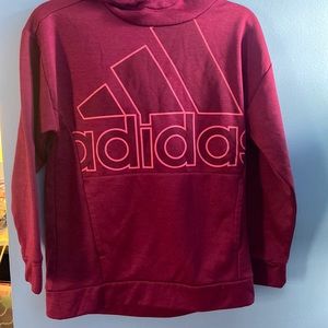 A pink Adidas sweatshirt